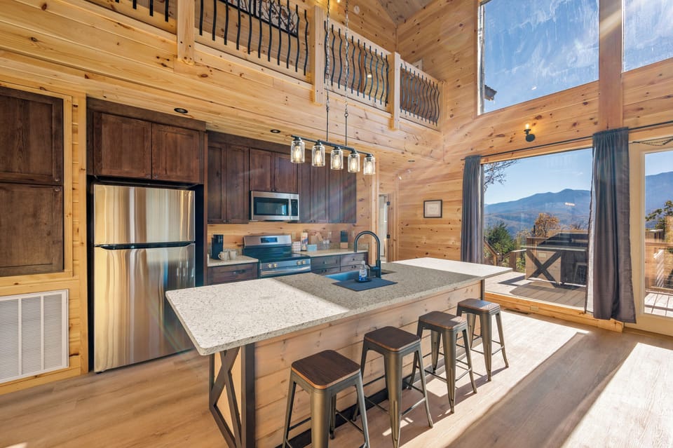Fully equipped kitchen with modern appliances and counter seating