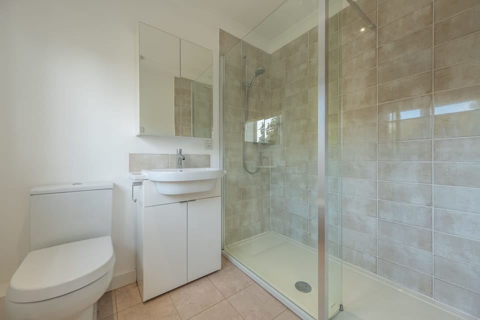 First floor: Bathroom with large walk-in shower