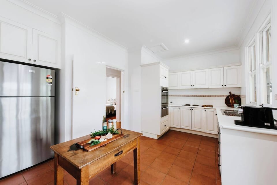The country kitchen is fully-equipped for your holiday catering with premium appliances and a moveable island for easy meal prep.