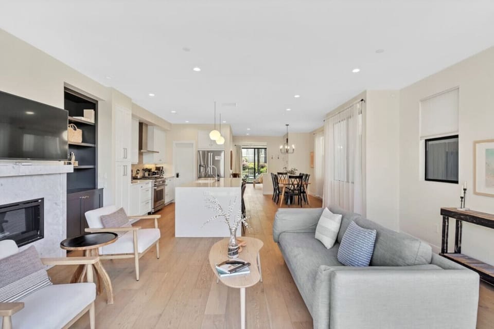 Main lower level living room - Fireplace with TV above it