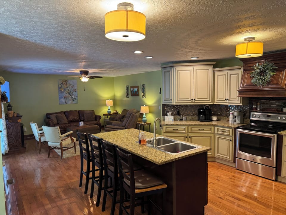 open concept kitchen, tv room and breakfast nook.