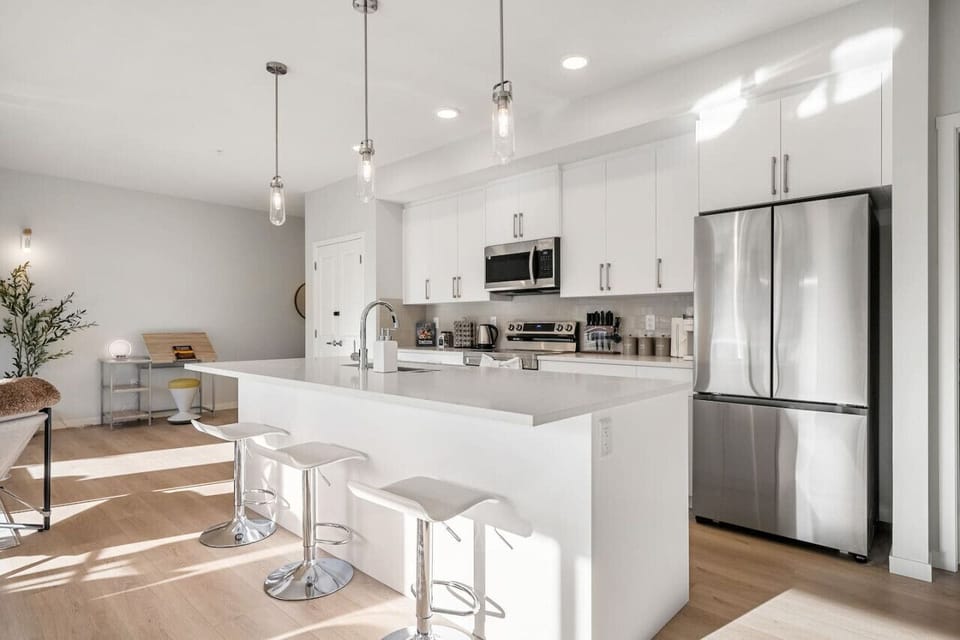 Kitchen island with addtional 3 seating areas. Fully stocked kitchen with pots, pans, spice rack, rice cooker, toaster and more.