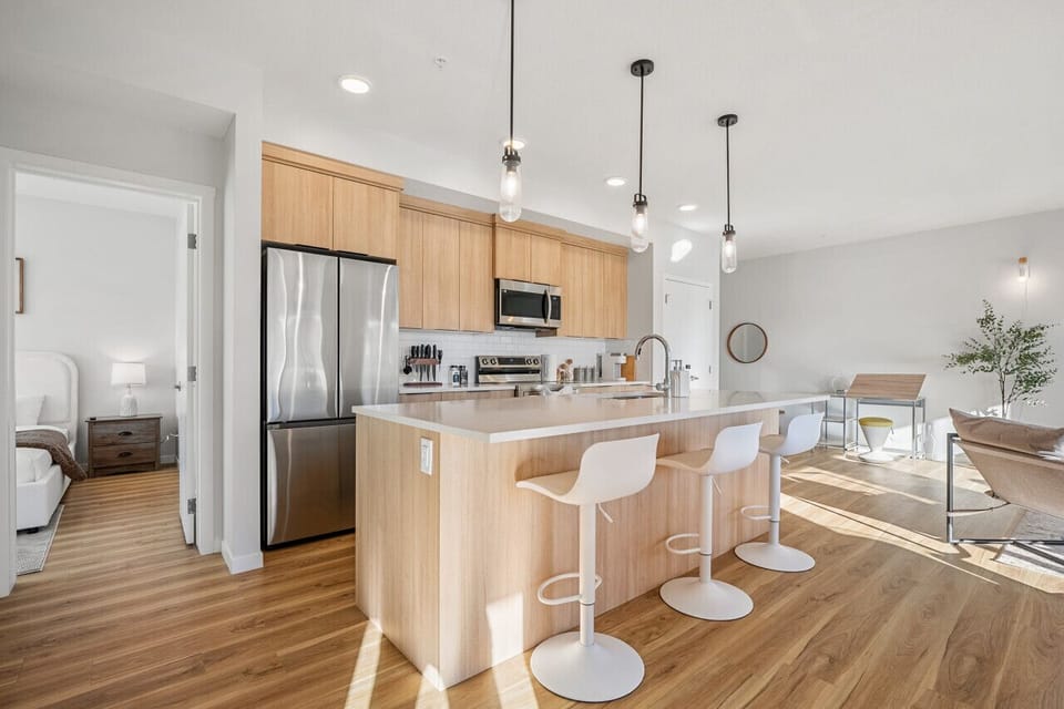 Kitchen island with addtional 3 seating areas. Fully stocked kitchen with pots, pans, spice rack, rice cooker, toaster and more.