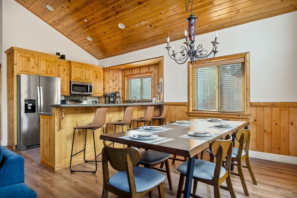 Dining space and additional seating at the kitchen bar area.