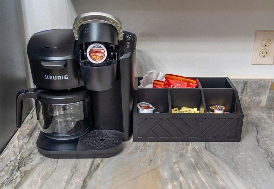 Start your mornings right with a coffee station featuring a Keurig and everything you need for the perfect brew—because a good day starts with great coffee.