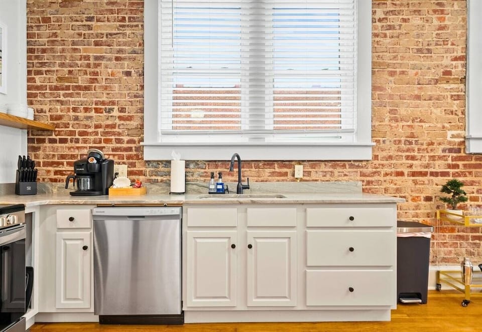 Bright and thoughtfully designed, this kitchen includes stainless steel appliances and everything you need for cooking.
