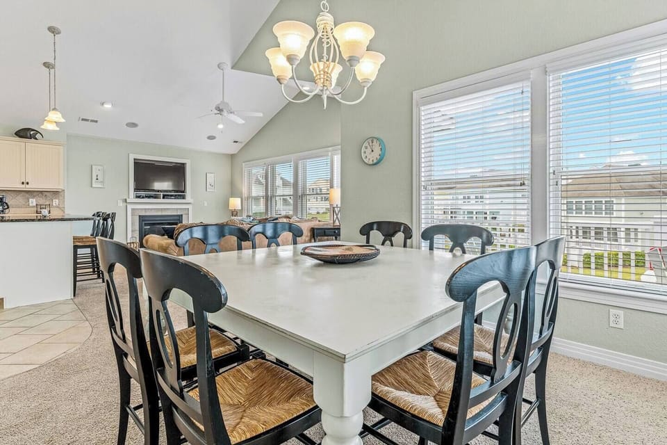 Dining space is in close proximity to kitchen, breakfast bar, and living room for the perfect family atmosphere. 