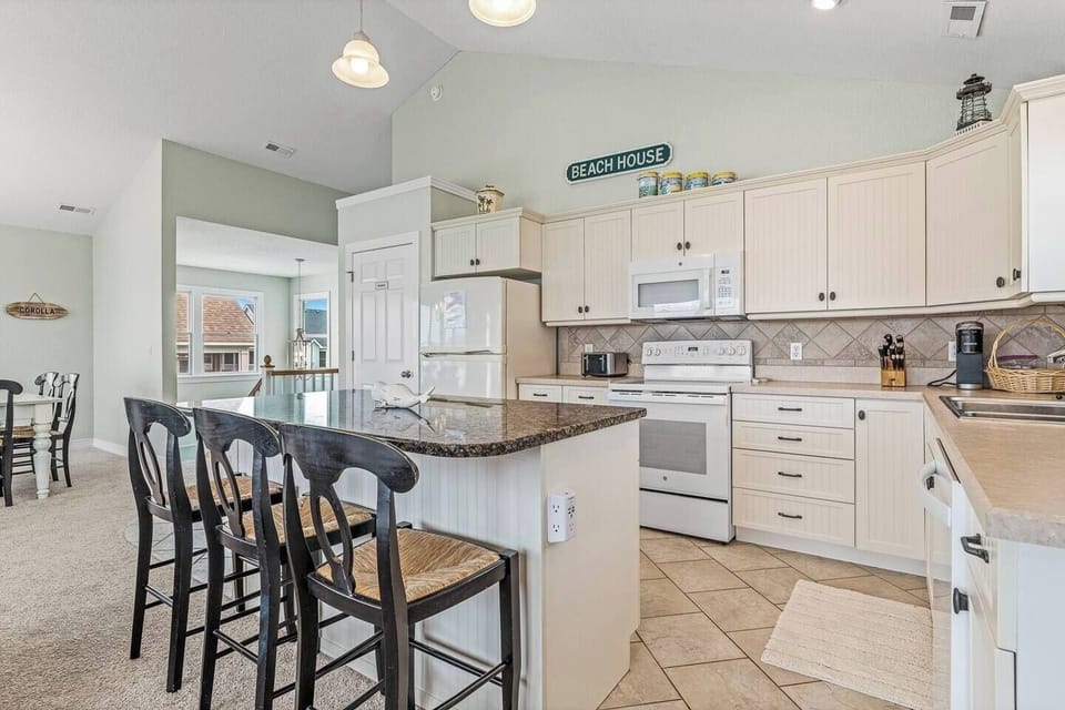 Updated kitchen with all amenities needed to cook a large family meal! Seating for three at the eat in bar countertop!