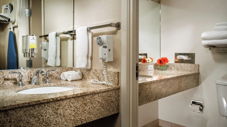 Get ready comfortably with expansive counters and bright mirrors.