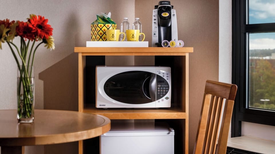 Enjoy easy snacks anytime with microwave, mini-fridge, and coffee.