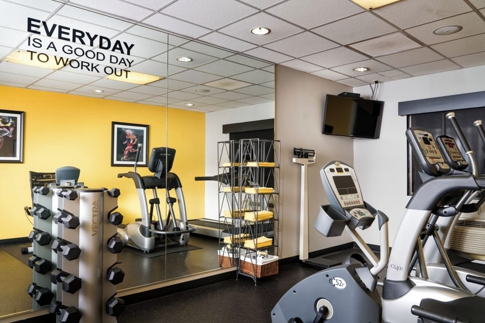 Energize your day with a bright, well-equipped workout room.