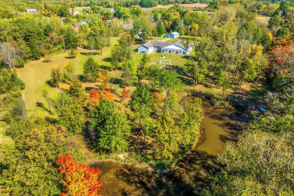 Aerial View | On-Site Pond | Spacious Yard