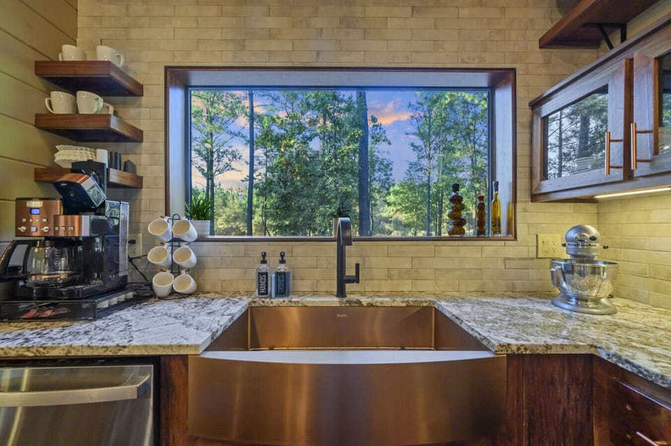 Thoughtful modern finishes like this sleek sink can be found all through the home.