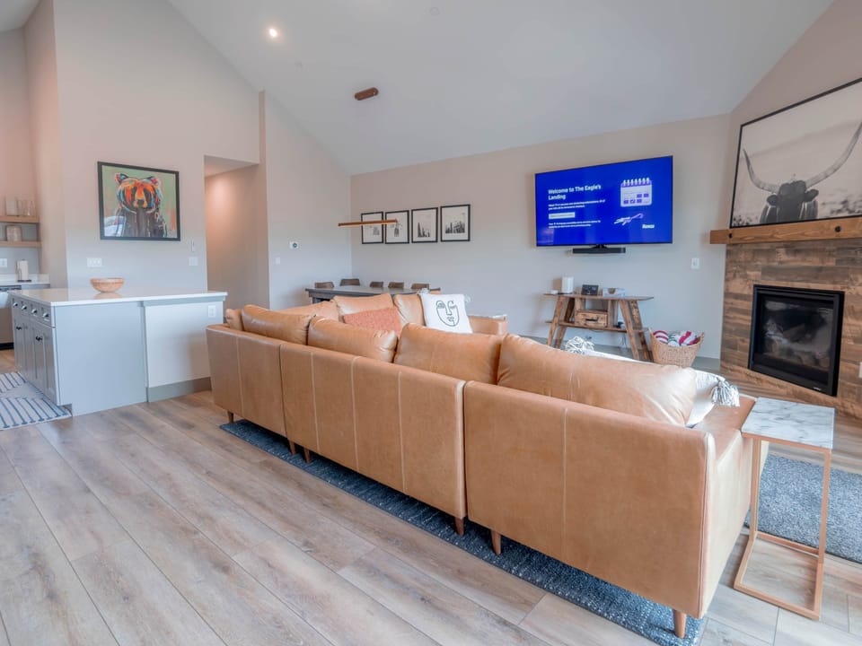Upstairs offers a spacious open-concept living area, perfect for relaxing and socializing.