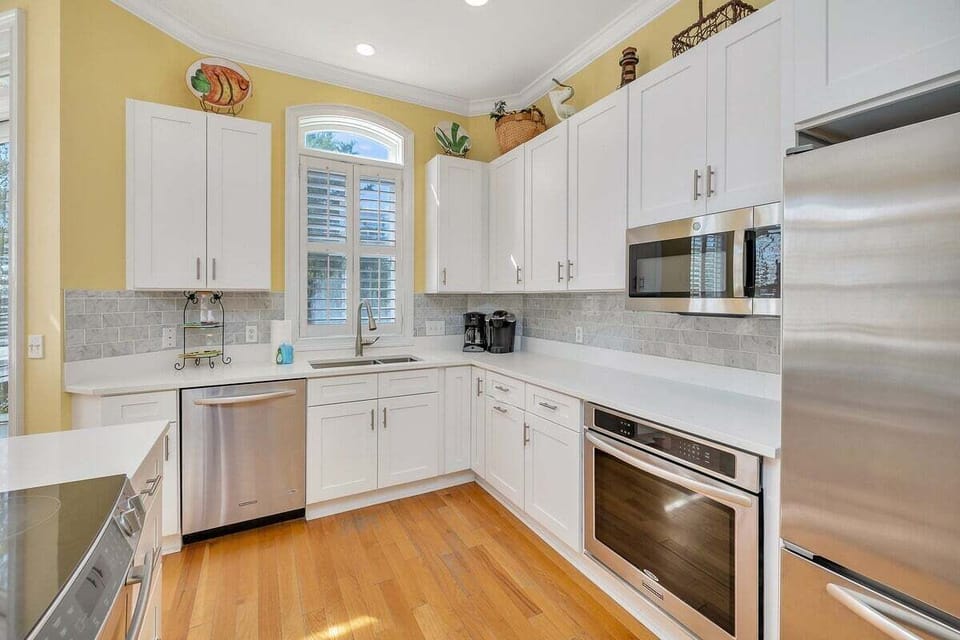 Kitchen with white cabinets and stainless steel appliances