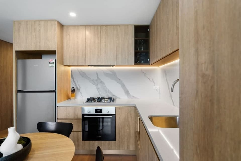 Modern kitchen with all appliances and supplies included, providing everything you need for a convenient cooking experience.