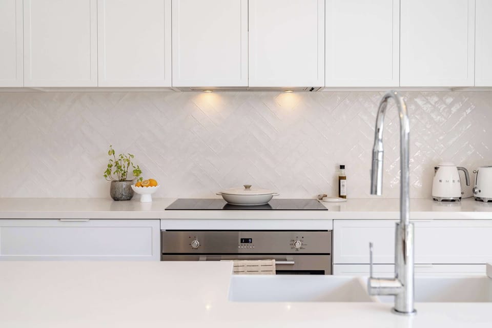 Featuring everything from high-quality cookware to a coffee pod machine, this kitchen is fully equipped for any culinary creation