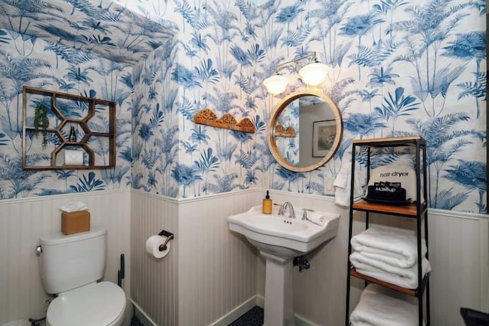 Swank 6: Charming en-suite bathroom with vintage pedestal sink.