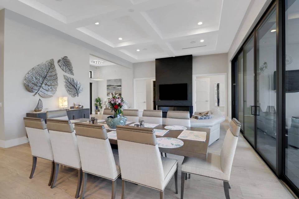 Back inside, the formal dining table seats 10 - wonderful for meals or an enjoyable family game night.