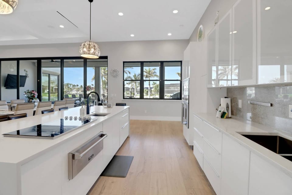 A large pass-thru window opens to the outdoor kitchen, allowing you to create great meals - indoor and out.