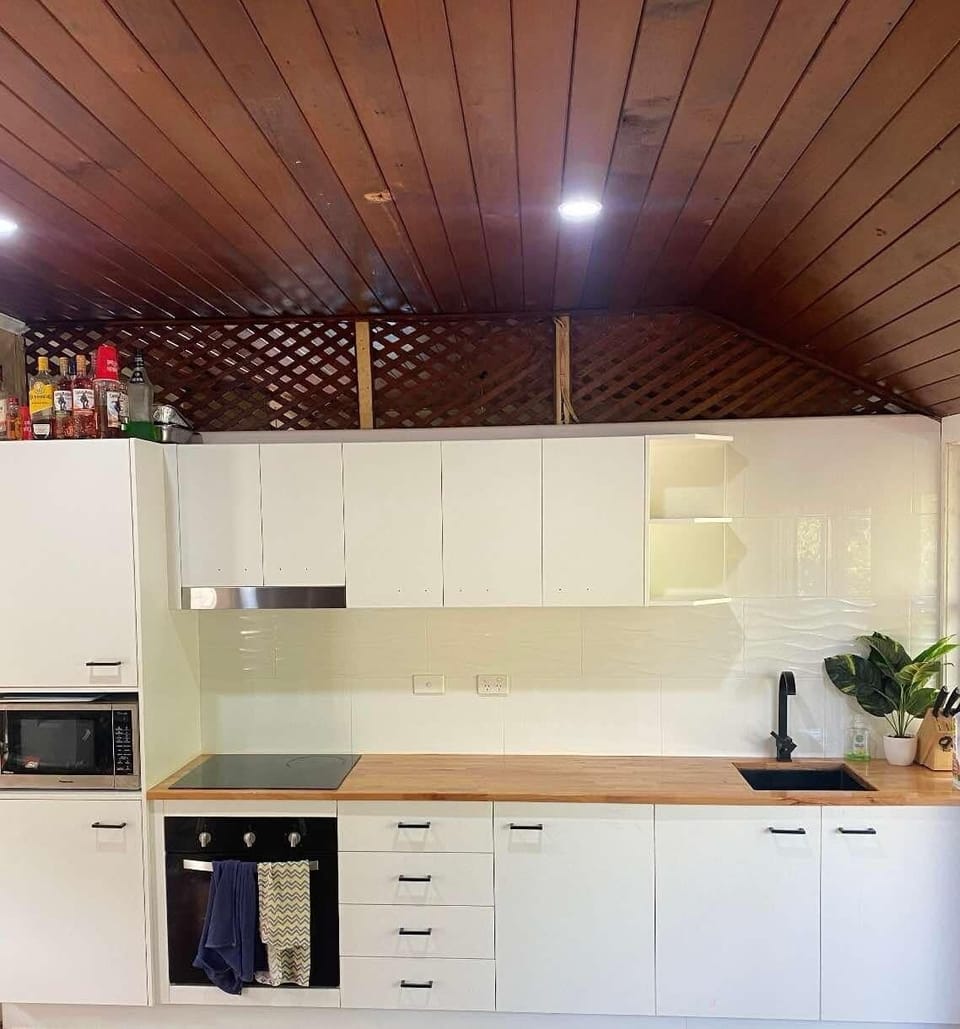 Kitchen has oven microwave air fryer