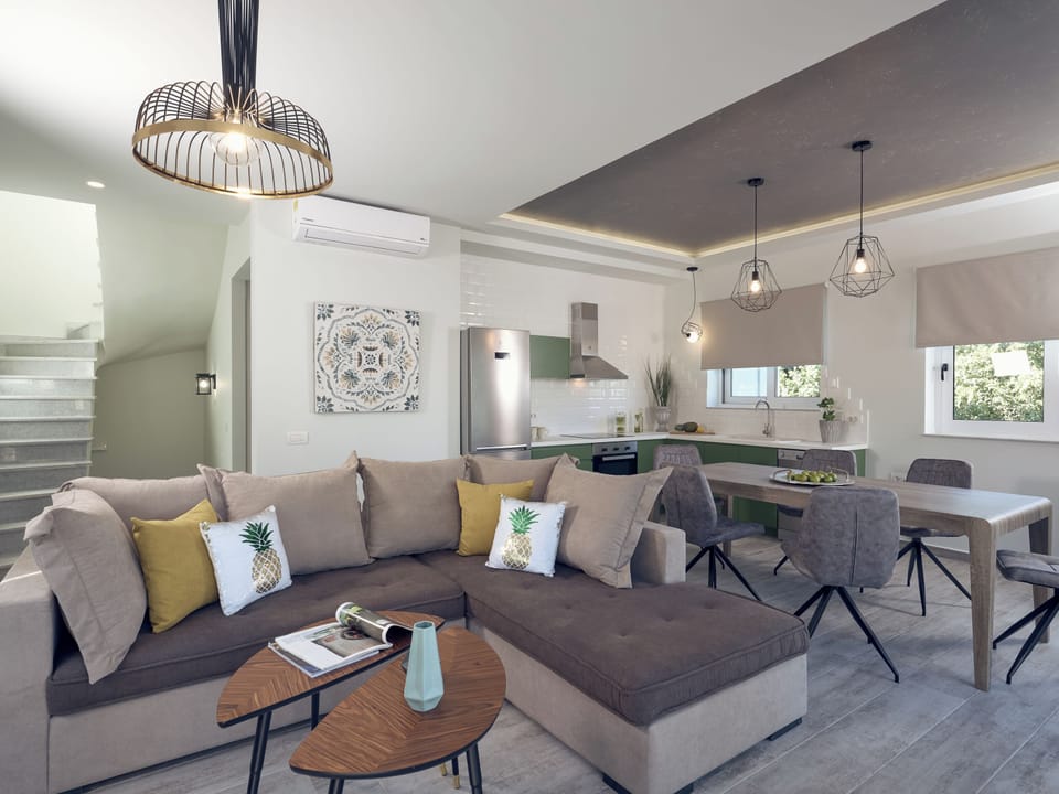 The fully equipped kitchen and cozy living room, perfect for family gatherings.