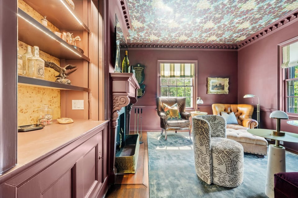 Retreat to this bold and luxurious lounge, where rich tones, a custom ceiling, and plush seating create a one-of-a-kind family hangout or reading nook. Complete with a stylish built-in bar, it’s perfect for unwinding in elegance.
