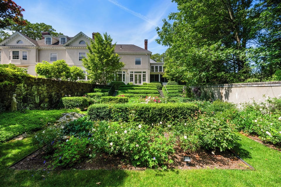 Stroll through manicured gardens and enjoy the peaceful luxury of this expansive estate, perfect for family playtime or quiet morning coffee. Surrounded by lush greenery and elegant landscaping, it’s a serene retreat just steps from the home.

