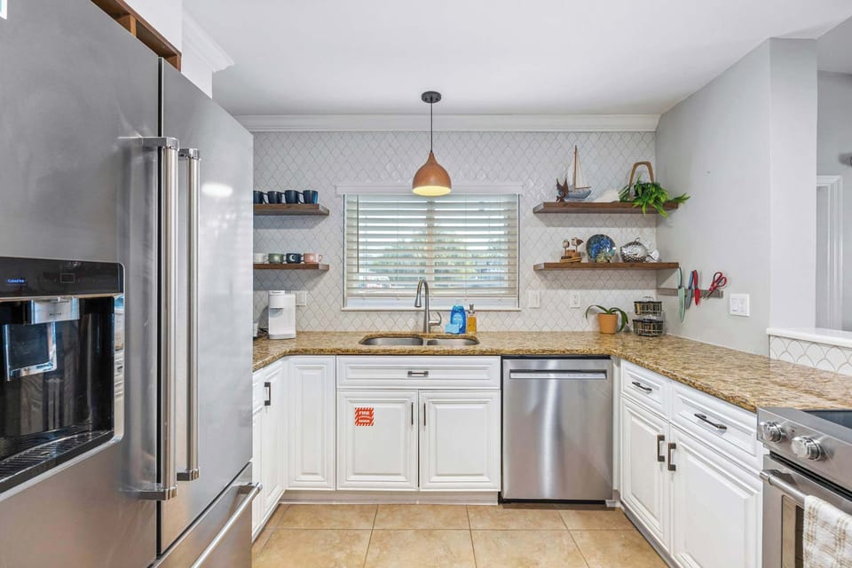 Modern kitchen with granite countertops and stainless steel appliances