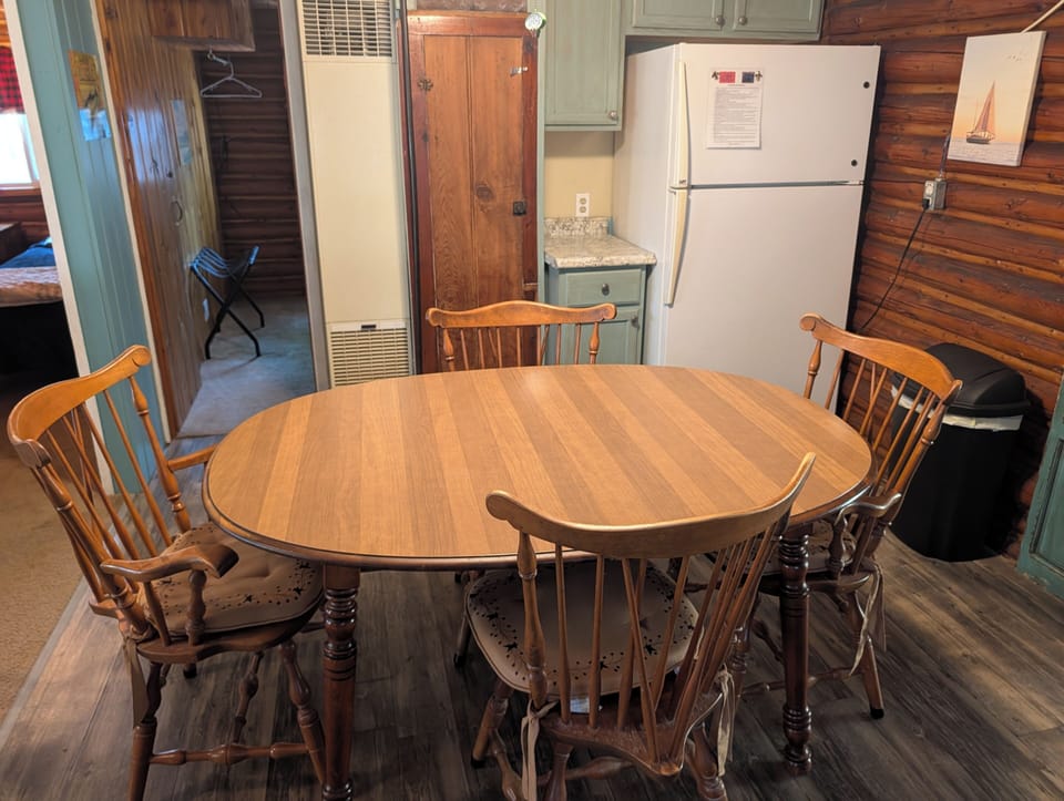 DINING AREA:  There is a cute dining table with seating for 4 adults in the middle of the kitchen.