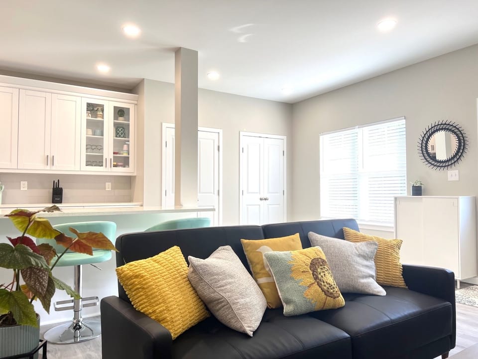 The living room has a large HD television and 3 sofas that convert into beds.