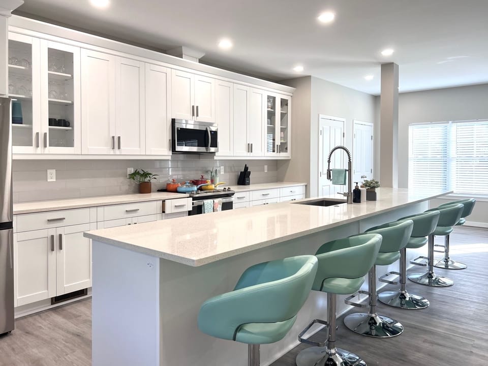 The kitchen has microwave, stove/oven, refrigerator, dishwasher, and disposal.