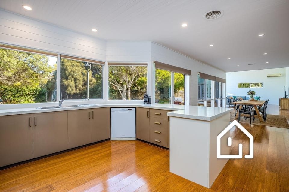 Well-appointed modern kitchen with Nespresso coffee pod machine and frother