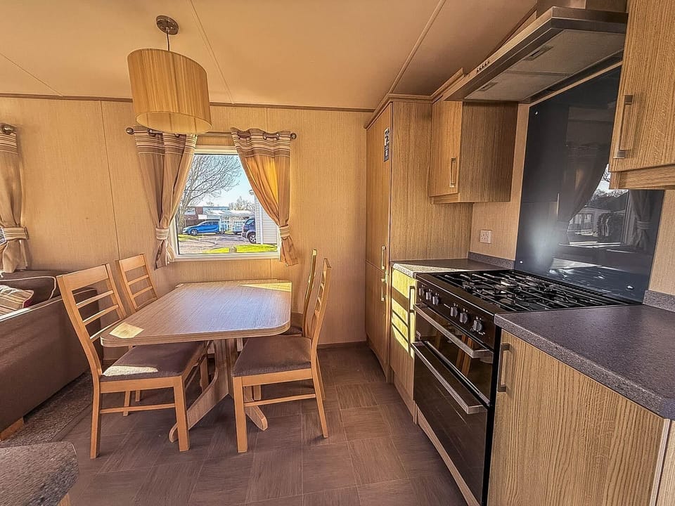 Enjoy the best of both worlds with family holidays 2026 at Hopton Holiday Village Norfolk—relax on the sandy Great Yarmouth beaches and cook up a storm in the kitchen area of a caravan.