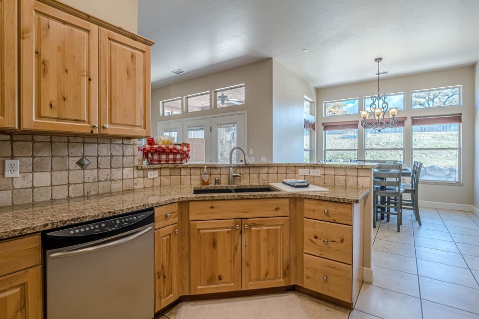 With stunning stone tile flooring throughout, this space feels both elegant and inviting.
