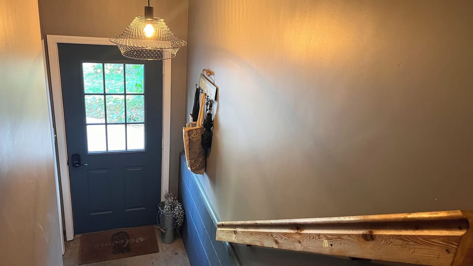 Private entrance interior photo. Stairway has railing.