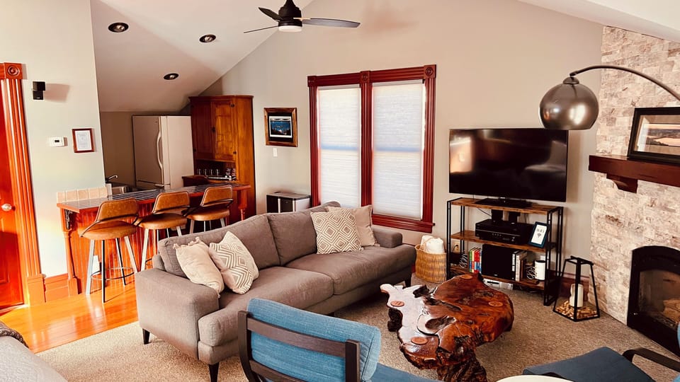 Living Room with Fireplace, TV, Surround Sound.