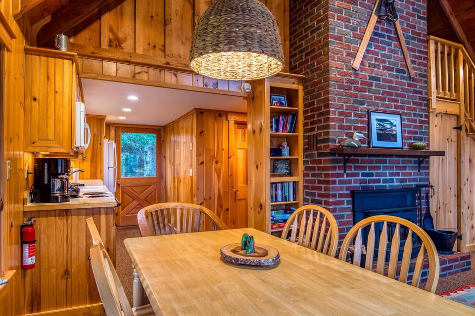 Dining table with view of kitchen and entryway