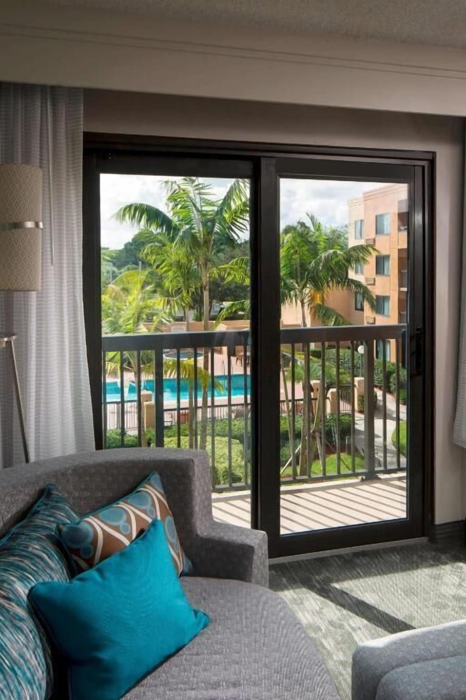 Step onto the balcony and savor breezy palm views.