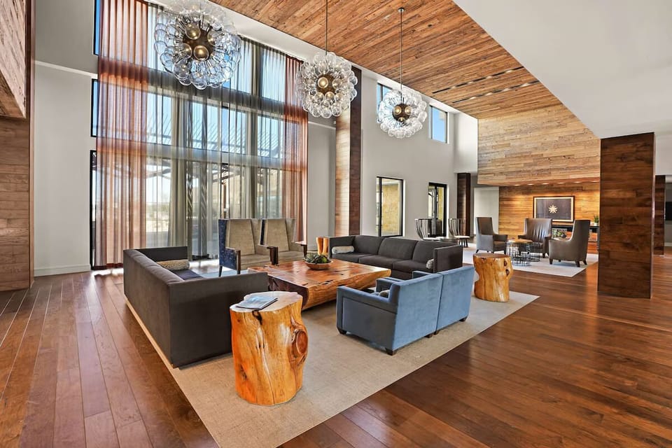 Stretch out in warm wood-and-glass elegance, perfect for chats.