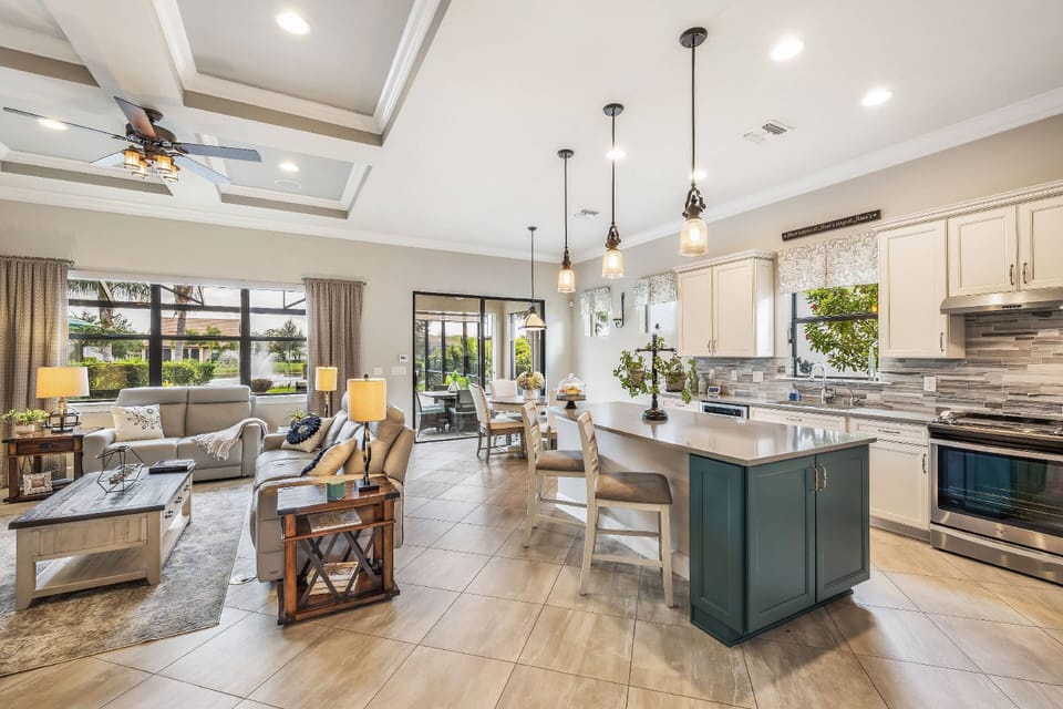 The living room, kitchen and dining area all easily flow together in one exquisitely designed open space.
