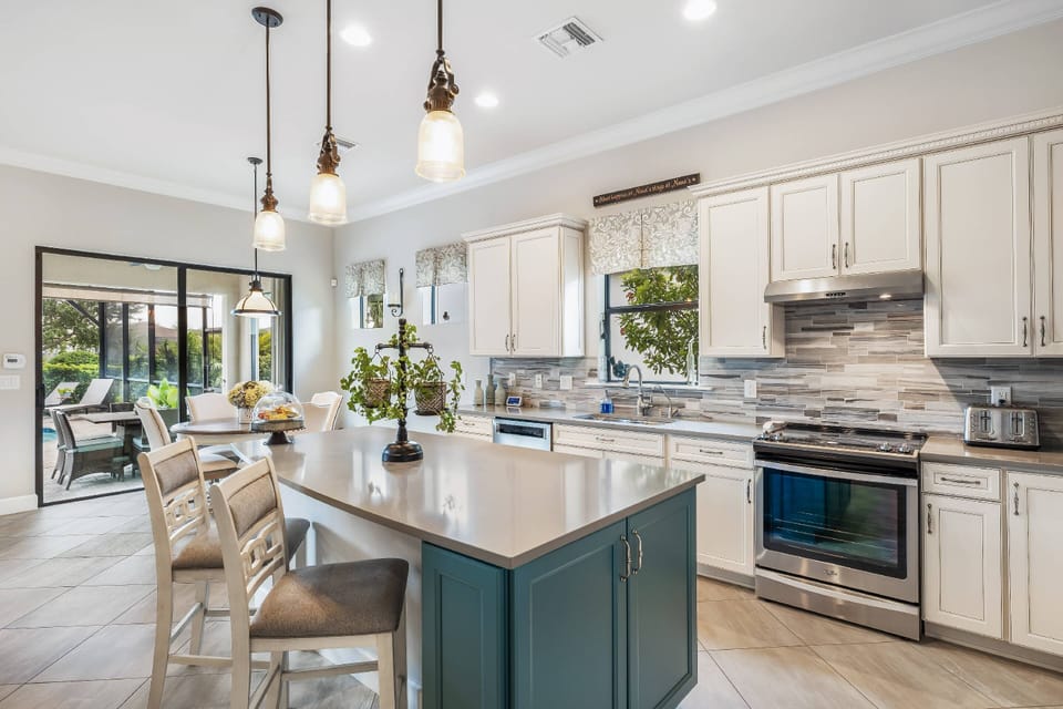 The kitchen has upgraded appliances, including refrigerator/freezer, stove, microwave and dishwasher.