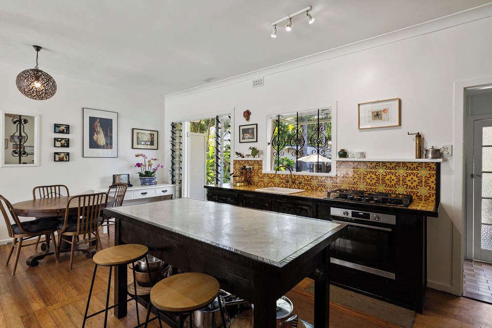 Kitchen and dining area. Table seats 6 but has an extension for up to 10 people.