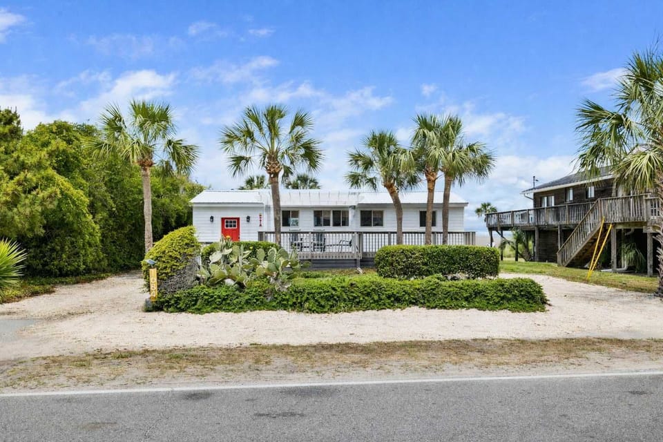Welcome to you Folly Beach Cottage! There are endless views of both the ocean and Folly Creek from the rooftop deck! Walk to the beach located just across the street :)