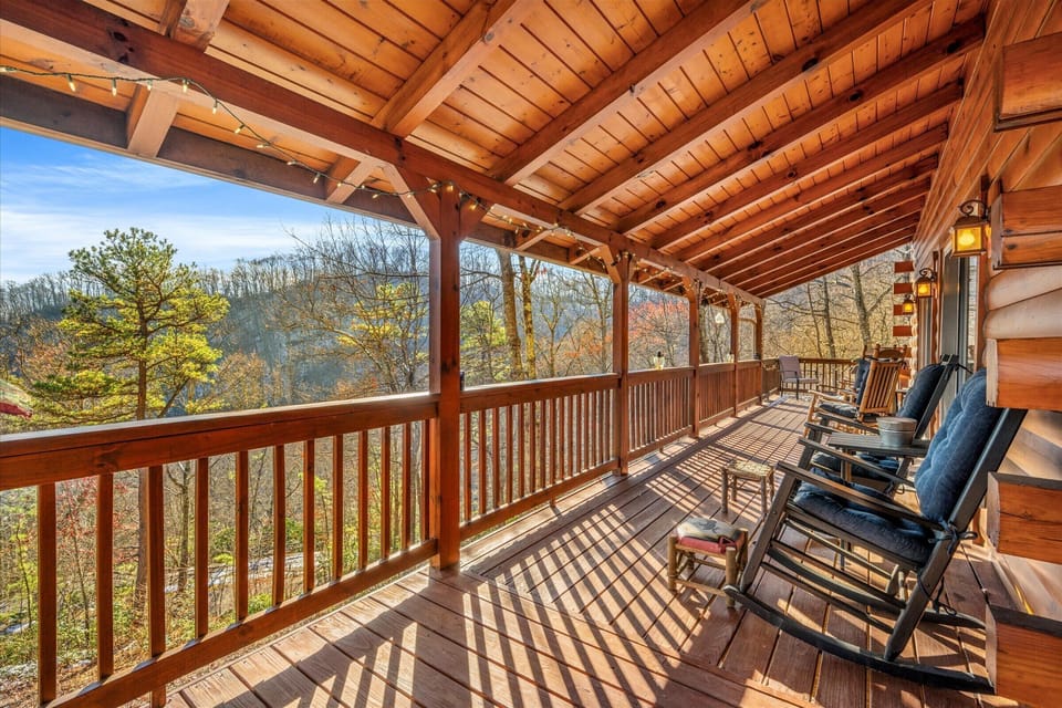 Spacious covered porch with rocking chairs perfect for relaxing mountain morning
