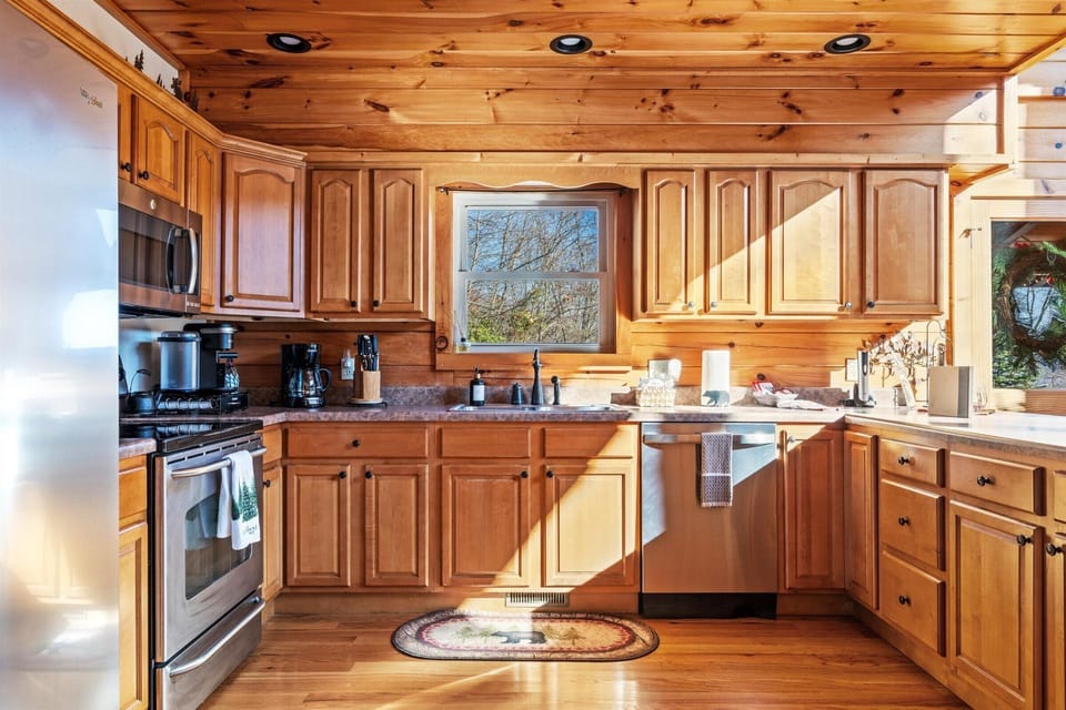 Sunny cabin kitchen, fully equipped for cozy, home-cooked meals.