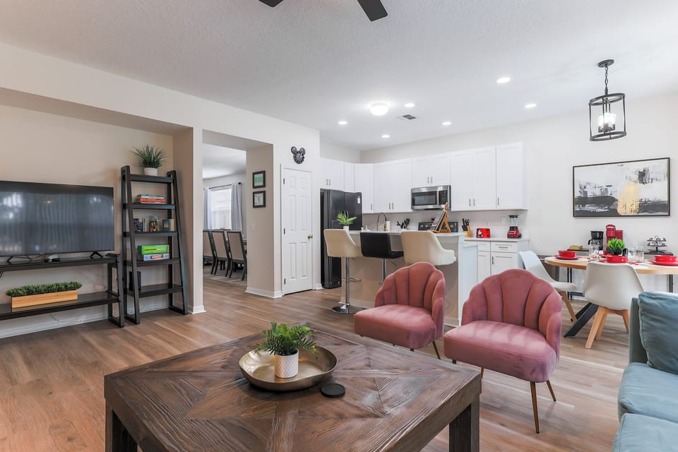 Sink into plush, comfy couches and chairs in this open-concept family room, perfect for movie nights, game days, or just relaxing together.
