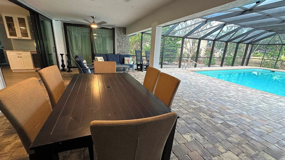 The poolside dining table seats 6.