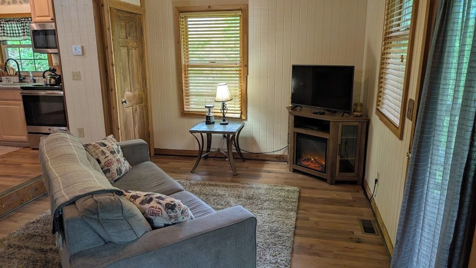 Unwind in the evenings by the TV & enjoy the ambiance of the electric fireplace!