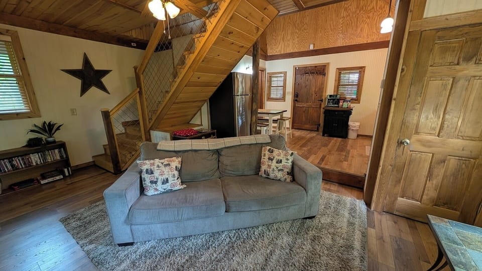 Living room & ajoining kitchen.  The vaulted ceilings make the space feel huge!